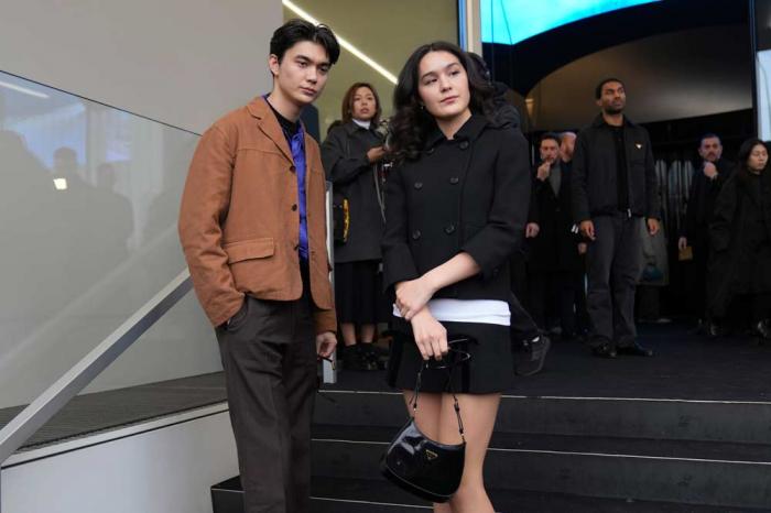William Gao and Olivia Hardy arrive as they attend at the men's Prada Fall-Winter 2025-2026 collection show, that was presented in Milan, Italy, Sunday, Jan. 19, 2025