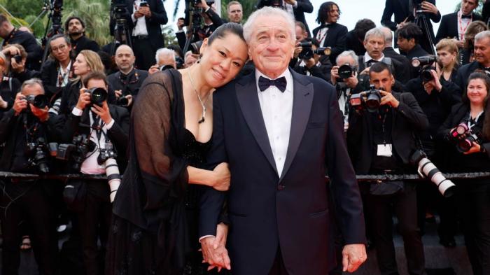 Tiffany Chen, left, and Robert De Niro pose for photographers during the opening ceremony red carpet of the 78th international film festival, Cannes, southern France, Tuesday, May 13, 2025