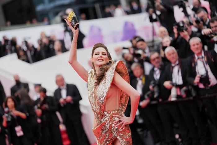 Frederique Bel poses for photographers during the opening ceremony red carpet of the 78th international film festival, Cannes, southern France, Tuesday, May 13, 2025