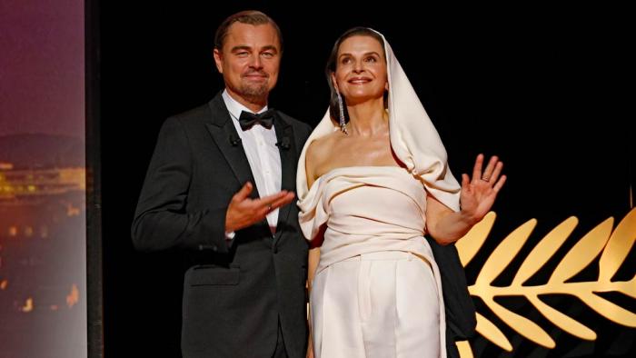 Leonardo DiCaprio, left, and jury president Juliette Binoche pose for photographers during the opening ceremony of the 78th international film festival, Cannes, southern France, Tuesday, May 13, 2025