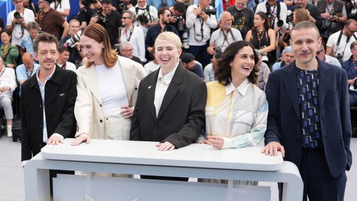 Jury president Molly Manning Walker, centre, and jury members Nahuel Perez Biscayart, from left, Vanja Kaludjercic, Louise Courvoisier, and Roberto Minervini pose for photographers at the photo call for the Un Certain Regard jury at the 78th international