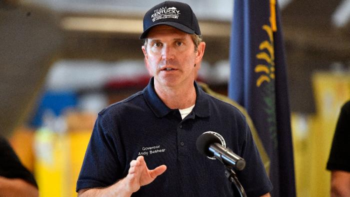 Gov. Andy Beshear gives an update on the recovery efforts from damage caused by severe weather at the London Corbin Airport in London, Ky., Saturday, May 17, 2025. (AP Photo/Timothy D. Easley)