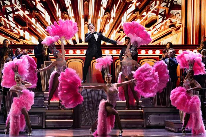 Jonathan Groff, center, performs a medley from "Just in Time" during the 78th Tony Awards on Sunday, June 8, 2025, at Radio City Music Hall in New York