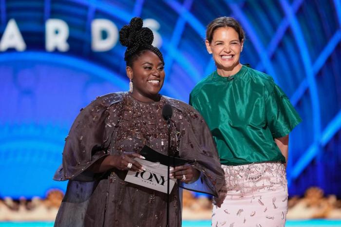 Danielle Brooks, left, and Katie Holmes present the award for best performance by an actor in a featured role in a play during the 78th Tony Awards on Sunday, June 8, 2025, at Radio City Music Hall in New York