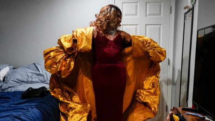 Mari Con Carne puts on their coat before attending Les Miserables at the Kennedy Center in drag, on the night that President Donald Trump and first lady Melania Trump were also in attendance, Wednesday, June 11, 2025, in Washington