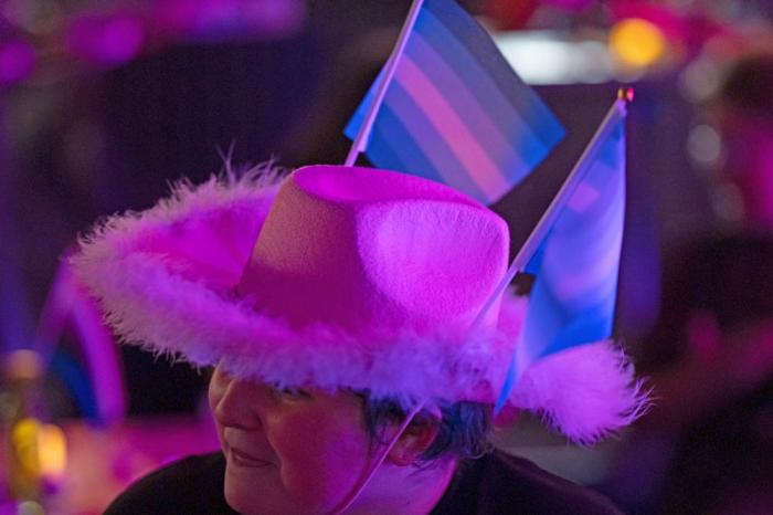 An attendee wears gay pride flags in their hat during a "Pink Pony Prom" held to celebrate teen and young adult members of the LGBTQ+ community on Friday, May 30, 2025, in Portland, Ore.