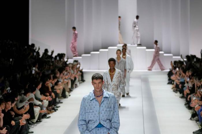 Models wear creations as part of the men's Dolce & Gabbana Spring-Summer 2026 collection, that was presented in Milan, Italy, Saturday, June 21, 2025