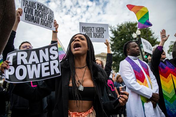 Protesters block the street in front of the Supreme Court.