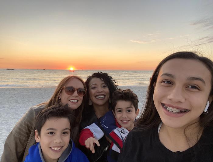 Theresa Volpe (L) pictured here with her wife, Mercedes Santos (R), and their children, Jaidon (L), Lennox (R) and Ava (R). Volpe is an educational content developer with more than 28 years of educational publishing experience.