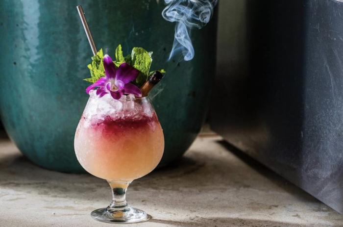 Rum to the Jungle, El Dorado 8 year, Clairin Casimir, Giffard Banane du Brésil, house made oat syrup, lemon, and a port float. (Donna Cocktail Club)