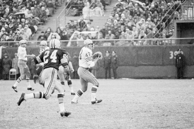 In this Dec. 4, 1966, file photo, San Francisco 49ers Dave Kopay, right, receives a pass and skampers for about 18 yards before Breen Bay Packers' Willie Woods catches him and brings him down in the third quarter in Green Bay, WI.