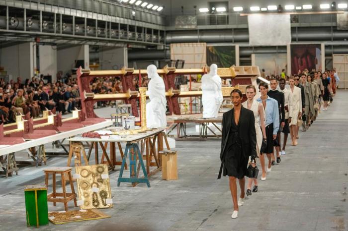 Models wear creations as part of the Tod's women's Spring Summer 2024 collection presented in Milan, Italy, Friday, Sept. 22, 2023. (AP Photo/Luca Bruno)