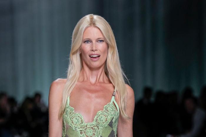 Claudia Schiffer wears a creation as part of the Versace women's Spring Summer 2024 collection presented in Milan, Italy, Friday, Sept. 22, 2023. (AP Photo/Antonio Calanni)
