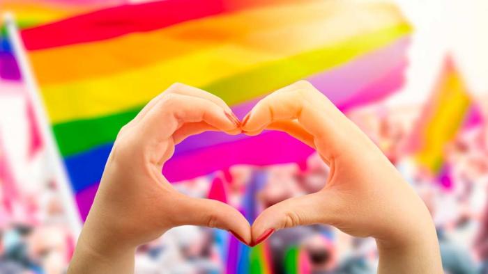 Heart hands at Pride parade