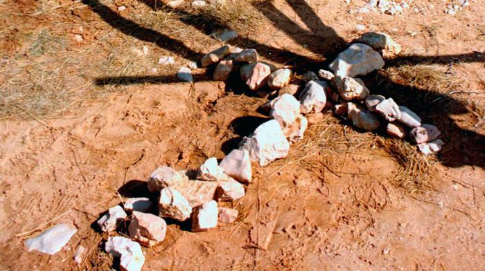 A makeshift cross sits beneath the fence outside of Laramie, WY where Matthew Shepard was murdered in 1998.