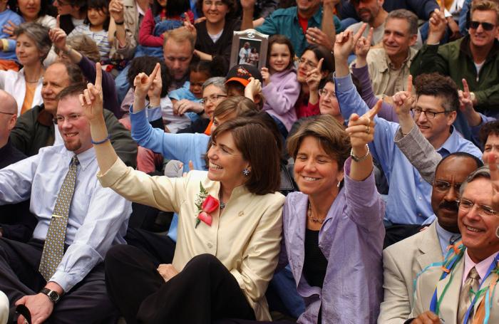 Hillary (L) and Julie Goodridge attend a ceremony on May 17, 2005 to celebrate the one year anniversary of the passing of the same sex marriage law in Boston, Massachusetts. The Goodridges were the first couple to be married under the law in the state of