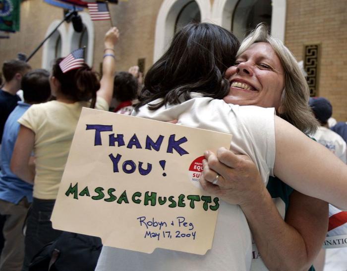 Robyn Ochs of Boston, right, hugs Kirsten Steinbach of Westborough, Mass., both gay marriage supporters, at the Massachusetts Statehouse in Boston in Sept. 2005, after the Massachusetts Legislature overwhelmingly rejected a proposed constitutional amendme