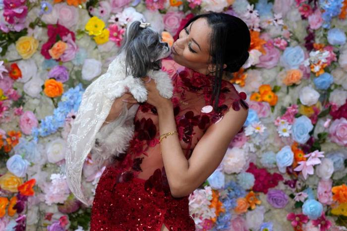 A dog and model attend the Pet Gala fashion show at AKC Museum of The Dog on Monday, May 20, 2024, in New York