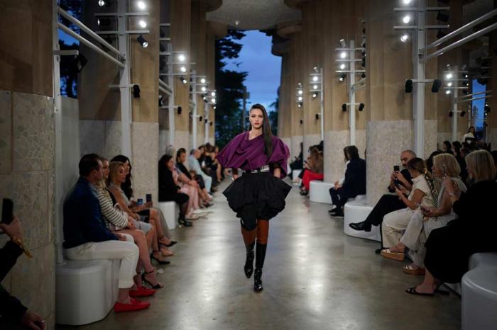 A model wears a creation by Louis Vuitton during a fashion show for the Cruise 2025 collection in the Park Guell in Barcelona, Spain, Thursday, May 23, 2024