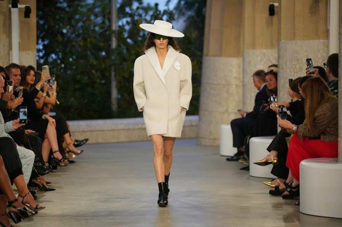 A model wears a creation by Louis Vuitton during a fashion show for the Cruise 2025 collection in the Park Guell in Barcelona, Spain, Thursday, May 23, 2024