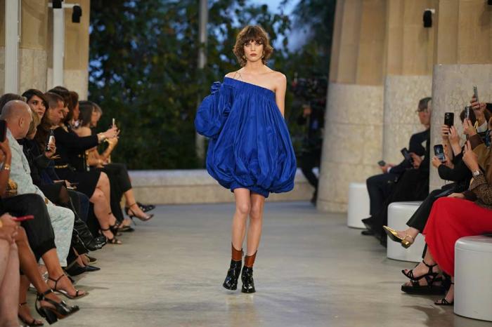 A model wears a creation by Louis Vuitton during a fashion show for the Cruise 2025 collection in the Park Guell in Barcelona, Spain, Thursday, May 23, 2024