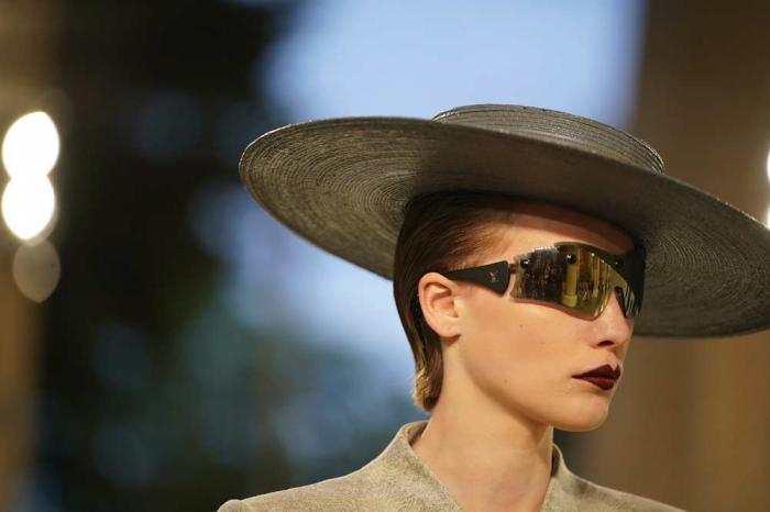 A model wears a creation by Louis Vuitton during a fashion show for the Cruise 2025 collection in the Park Guell in Barcelona, Spain, Thursday, May 23, 2024