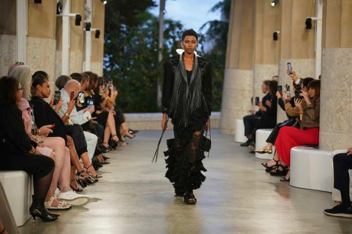 A model wears a creation by Louis Vuitton during a fashion show for the Cruise 2025 collection in the Park Guell in Barcelona, Spain, Thursday, May 23, 2024