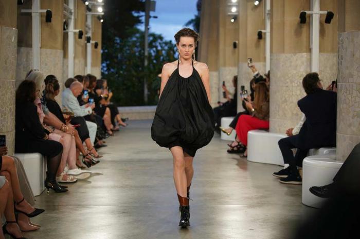 A model wears a creation by Louis Vuitton during a fashion show for the Cruise 2025 collection in the Park Guell in Barcelona, Spain, Thursday, May 23, 2024