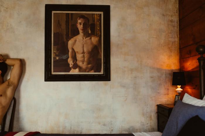 Model Mickey DiPietro in a room at Crew's Quarters Boarding House.