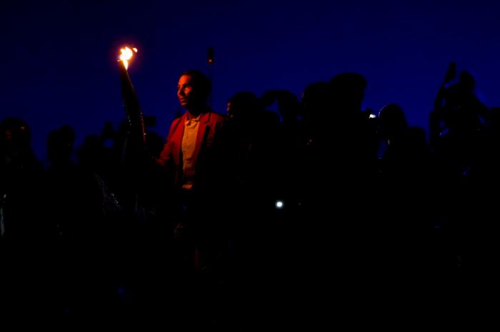 Spanish tennis star Rafael Nadal carries the torch during the opening ceremony of the 2024 Summer Olympics, Friday, July 26, 2024, in Paris, France. (AP Photo/Andy Wong)