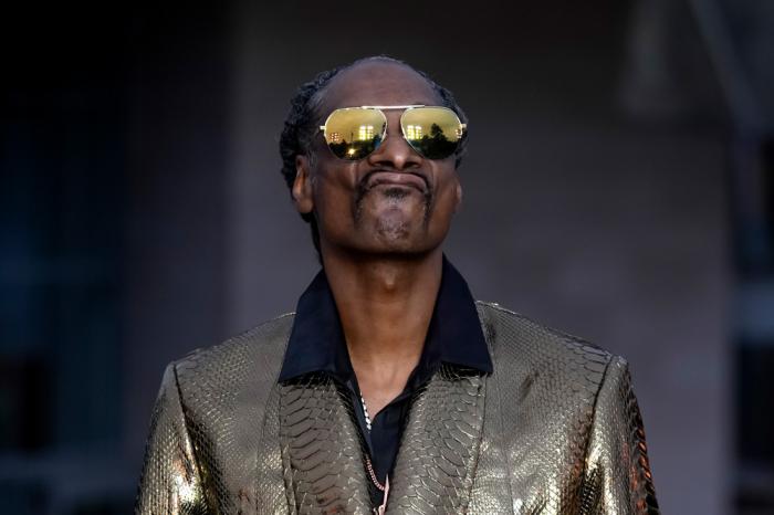 Snoop Dogg upon arrival at the Louis Vuitton Foundation on the eve of Paris Olympics opening ceremony, at the 2024 Summer Olympics, Thursday, July 25, 2024, in Paris, France. (AP Photo/Rebecca Blackwell)