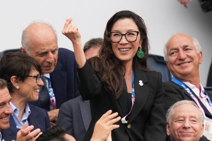 Michelle Yeoh gestures in Paris, France, during the opening ceremony of the 2024 Summer Olympics, Friday, July 26, 2024. (AP Photo/Thibault Camus)