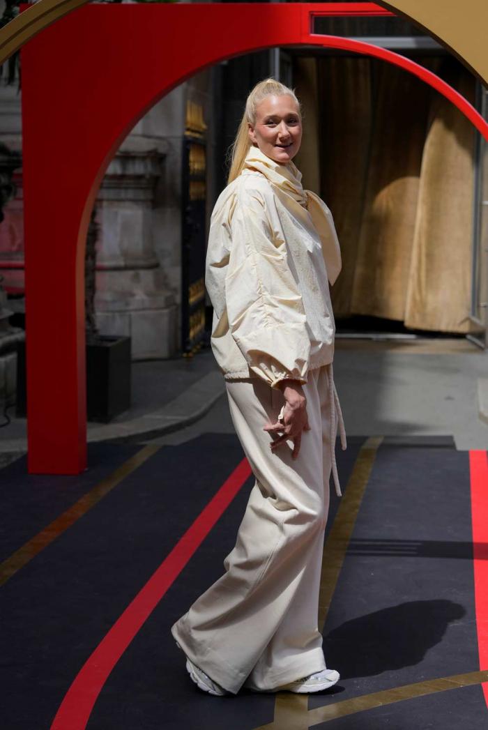 U.S. beach volleyball athlete Kerri Walsh Jennings wears a creation by Veronique Leroy and Aspics footwear, during the first gender equal Olympic Games fashion show, at the 2024 Summer Olympics in Paris, Sunday, July 28, 2024