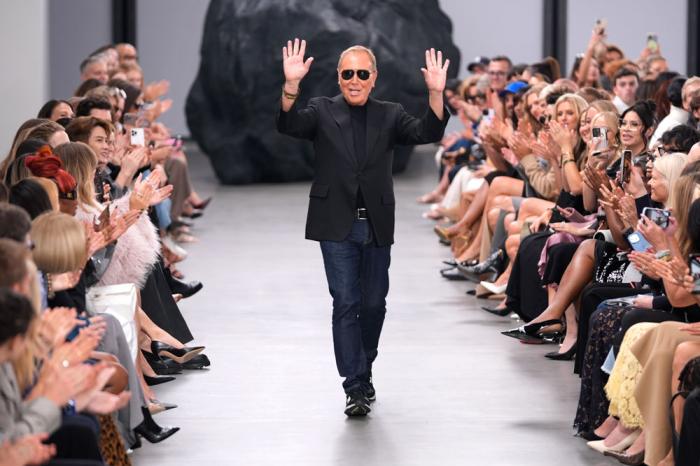 Designer Michael Kors waves to the crowd at the end of the Michael Kors Collection spring/summer 2025 fashion show as part of New York Fashion Week, Tuesday, Sept. 10, 2024, in New York