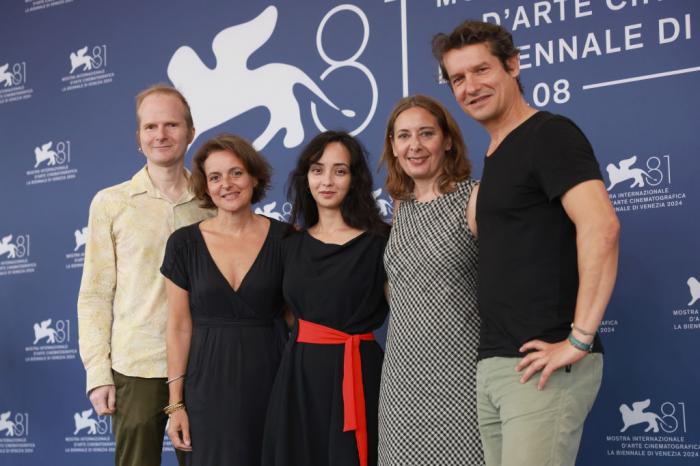 From left to right: Roland Schlimme, Sally Blake, Director Anastasia Trofimova, Cornelia Principe and Philippe Levasseur attend the "Russians At War" photocall during the 81st Venice International Film Festival at Palazzo del Casino on September