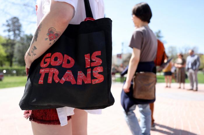 A transgender rights activist holds a bad during a demonstration on the University of Montana campus on May 03, 2023 in Missoula, Montana. (Photo by Justin Sullivan/Getty Images)