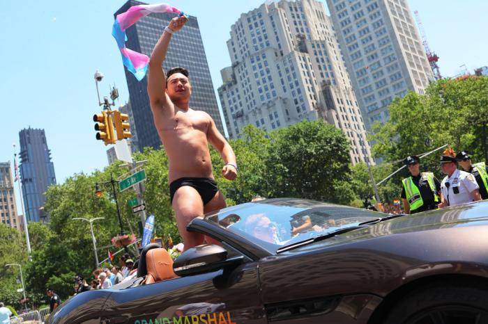 Schuyler Bailar, the first transgender athlete to compete in any sport on an NCAA Division I men's team and NYC Pride grand marshal, waves as he participates in the New York City Pride Parade on Fifth Avenue on June 26, 2022 in New York City.