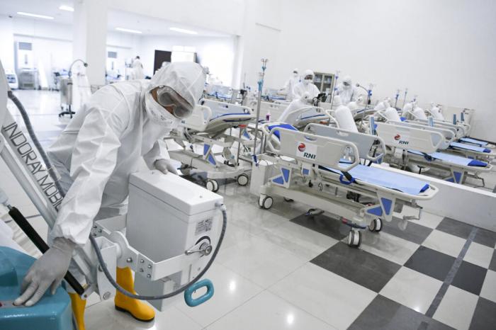 Staff inspect medical equipments at an emergency hospital set up amid the new coronavirus outbreak in Jakarta, Indonesia.