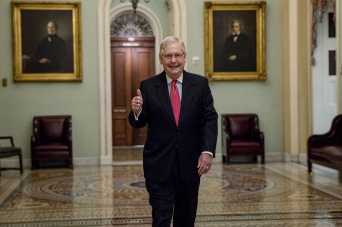 Senate Majority Leader Mitch McConnell of Ky. gives a thumbs up as he arrives on Capitol Hill.
