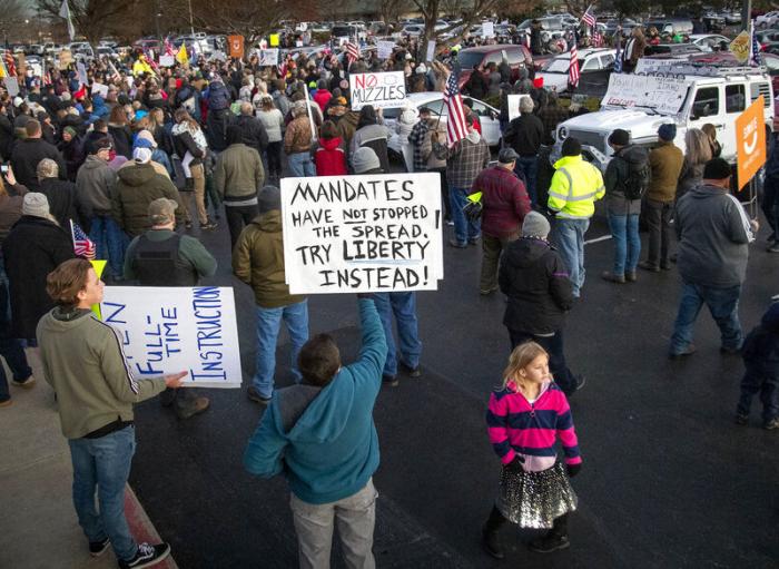 Anti-masker demonstrators converge on Central District Health offices in Boise, Idaho.