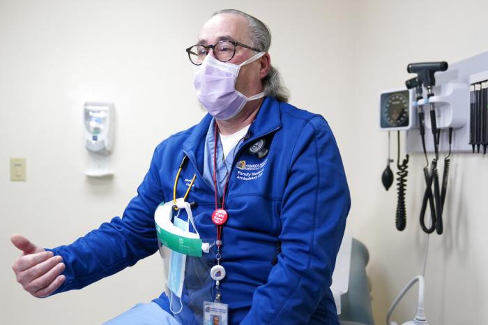 Dr. Alan Roth talks to reporters at Jamaica Hospital Medical Center in New York.