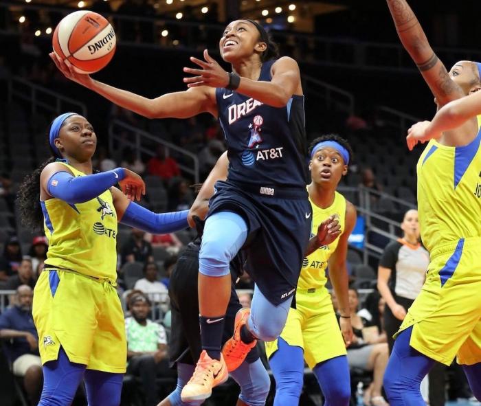 Renee Montgomery (center) played for, and now co-owns the Atlanta Dream.