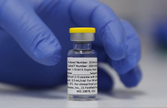 A vial of the Phase 3 Novavax coronavirus vaccine is seen ready for use in the trial at St. George's University hospital in London. 