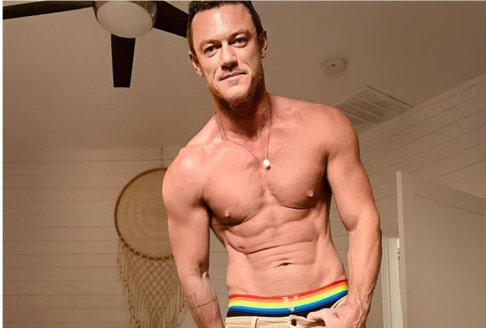 Luke Evans wearing Pride-inspired Versace underwear in Instagram post.