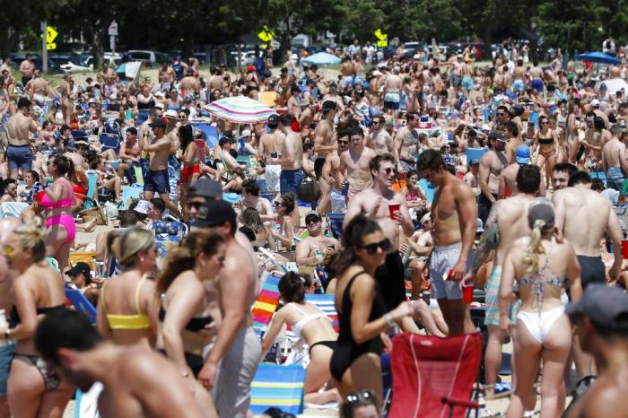 Crowds gather on L Street Beach in the South Boston neighborhood of Boston. 