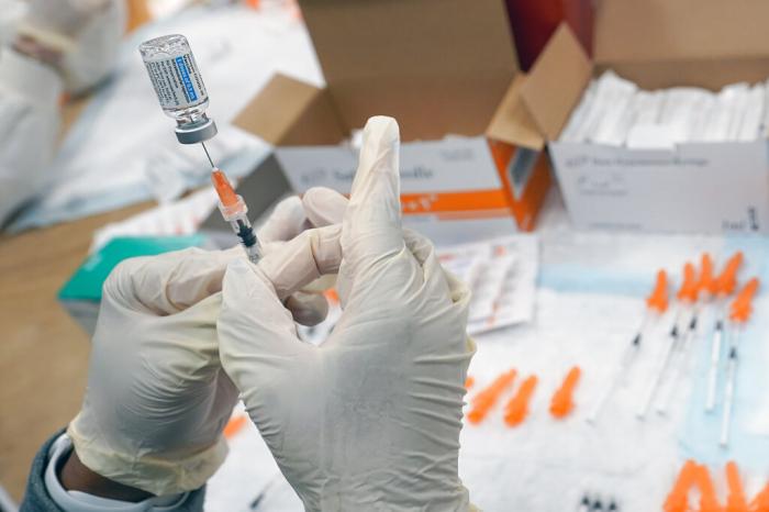 A registered nurse fills a syringe with the Johnson & Johnson COVID-19 vaccine at a pop up vaccination site in the Staten Island borough of New York. 