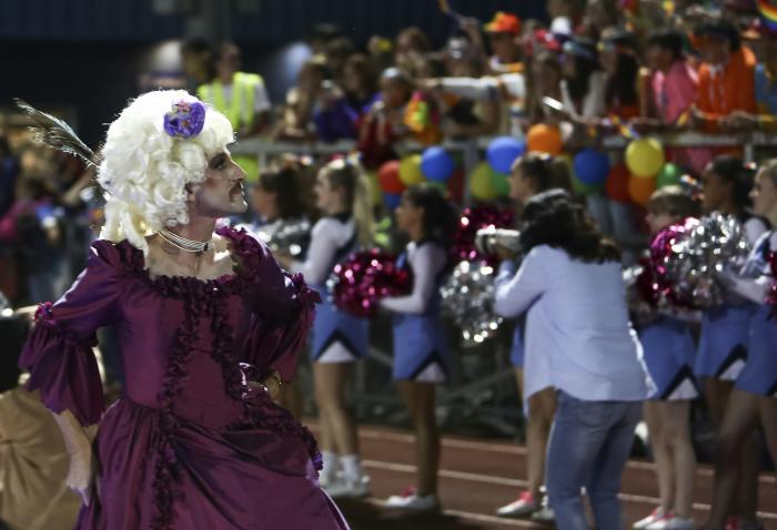 People participate in the "drag ball" halftime show at Burlington High School on Friday, Oct. 15, 2021 in Burlington, Vt.