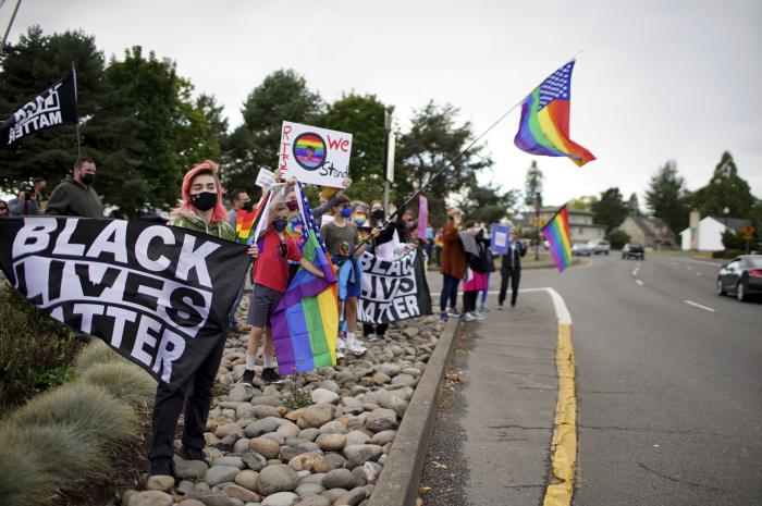 People rallied ahead of the Newberg, Ore., School Board vote on whether to ban Black Lives Matter and Pride flags at the school.