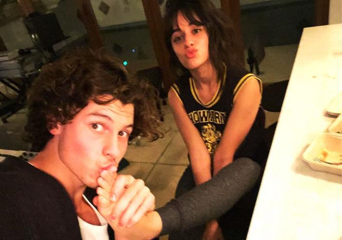 Shawn Mendes, left, with Camila Cabello, right.