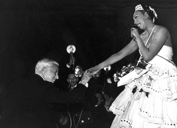 Charlie Chaplin congratulates entertainer Josephine Baker after her performance at the charity gala "Le Bal des Petits Lits Blancs," at the Moulin Rouge in Paris, on May 20, 1953. 